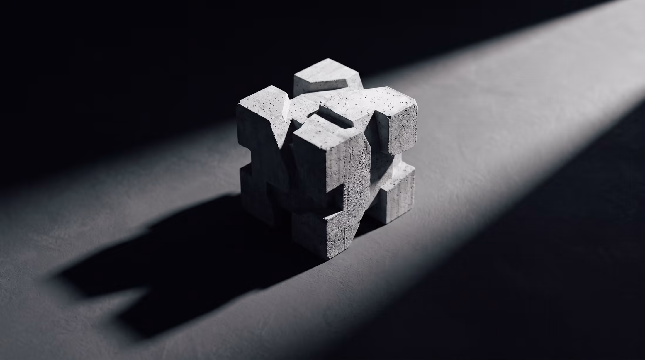 A concrete block casting a hard shadow