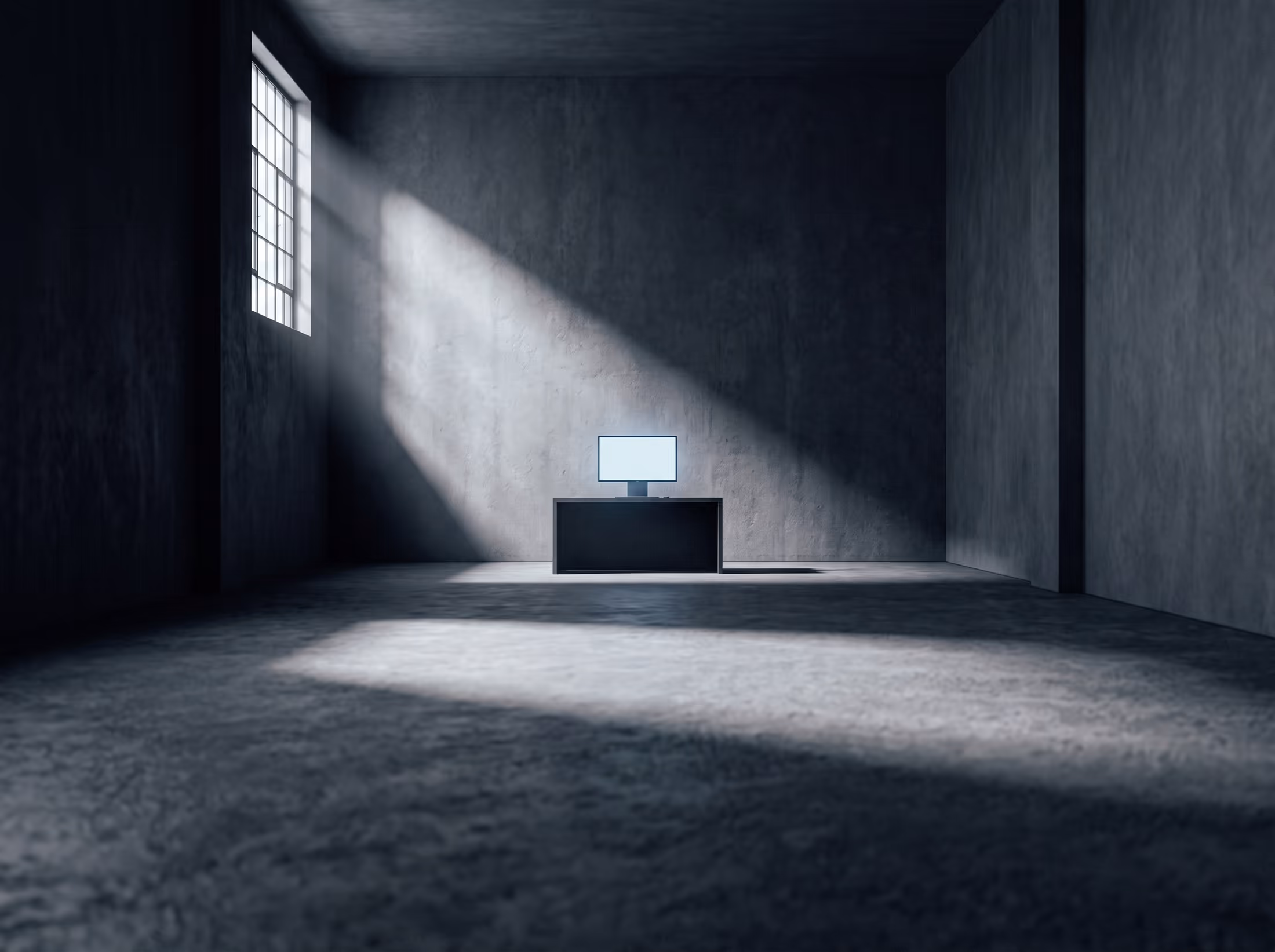 A wide empty studio interior in low light