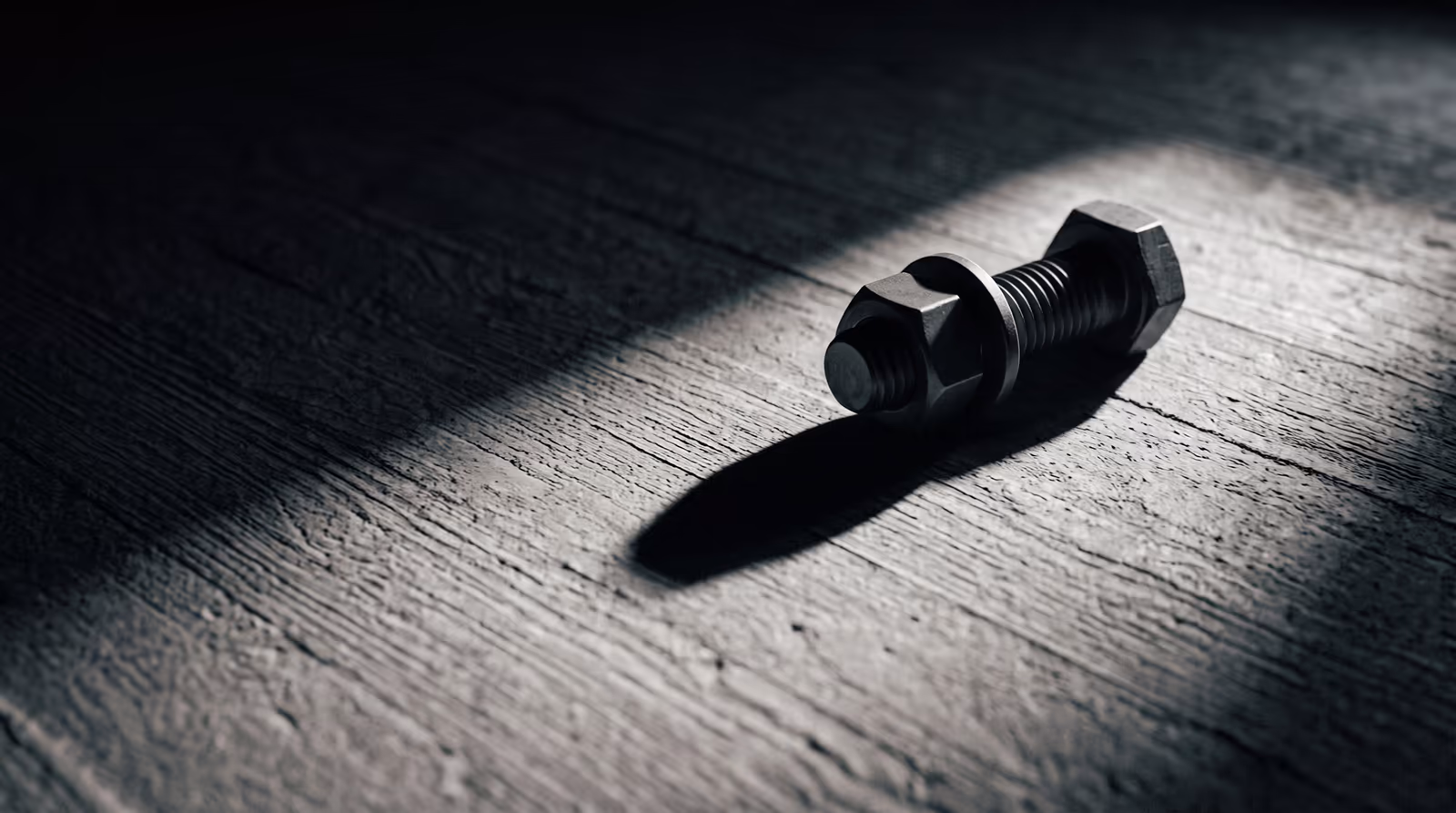 A bolt on concrete casting a long shadow